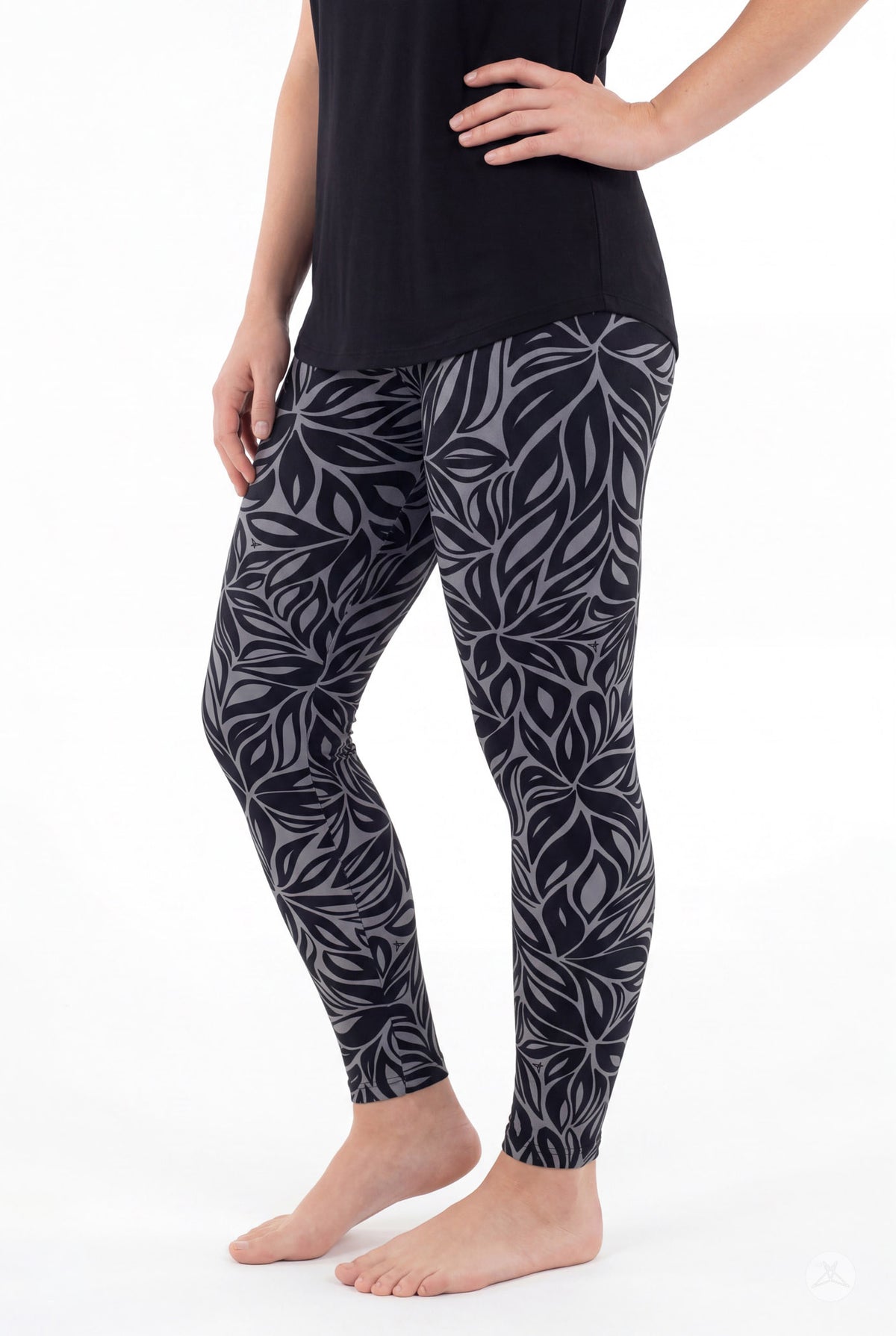 SweetLegs Shadow Petal Leggings modeled in a black and gray leafy botanical print