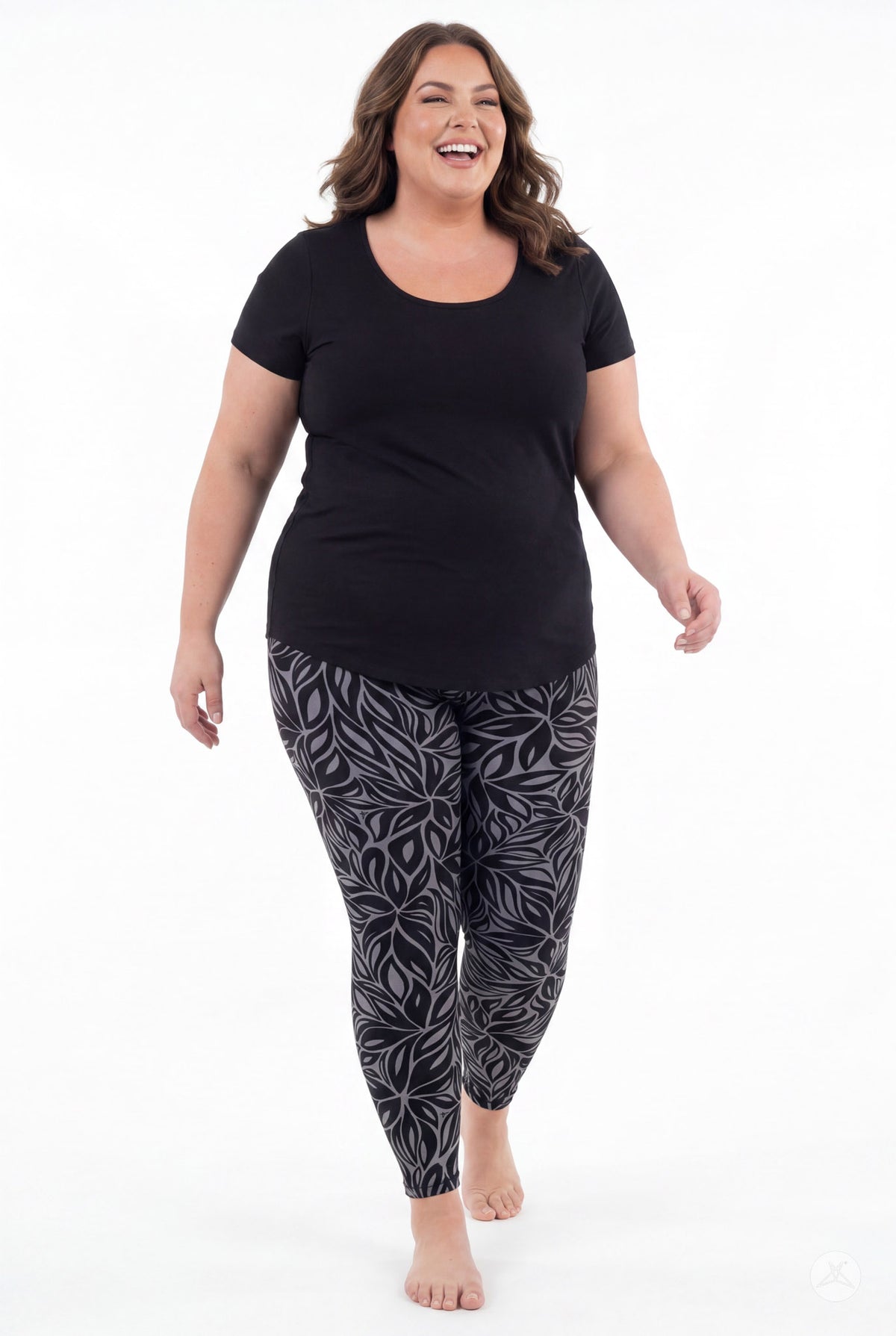 SweetLegs Shadow Petal Leggings on a smiling model with a black and gray leafy pattern