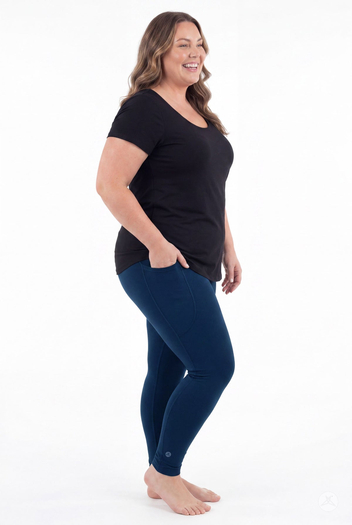 SweetLegs Still Water Pocket Leggings in navy blue on a smiling model