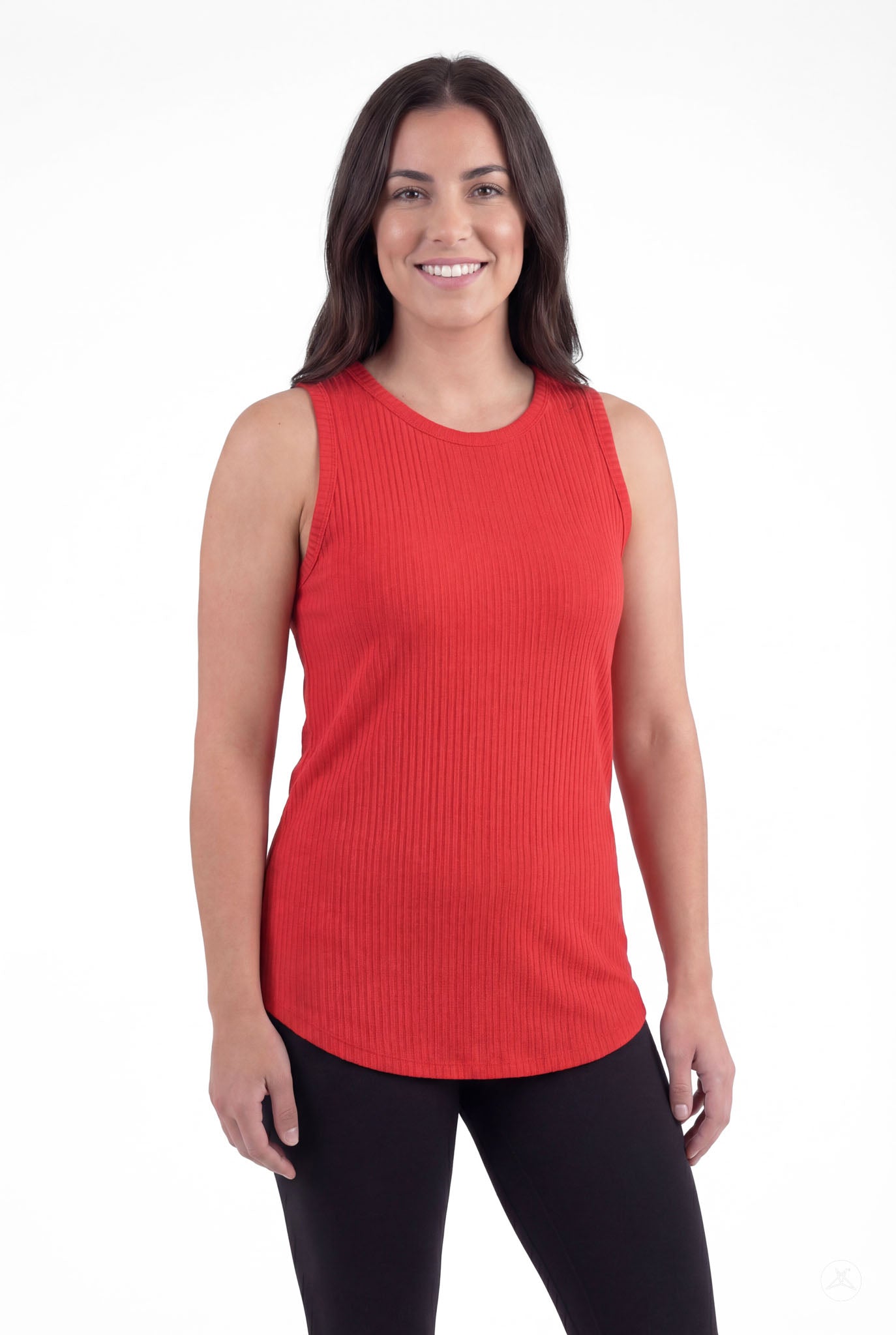 Woman wearing The Soft Ribbed Tank in vibrant red by SweetTops with sleeveless design and ribbed fabric texture smiling