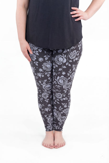 Shadow Garden floral leggings by SweetLegs featuring soft grey-blue roses on a dark background for elegant wear.