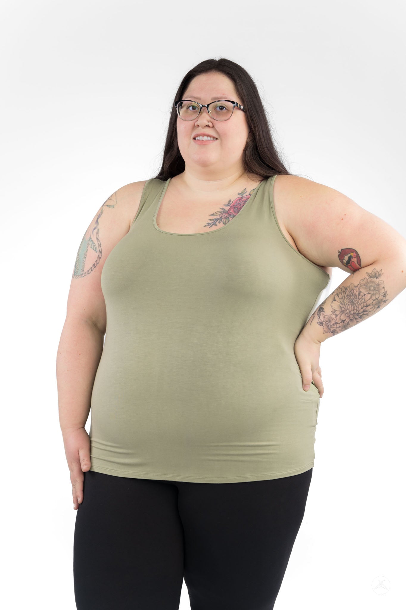 Plus size woman wearing olive Classic Tank Copy by SweetLegs Canada with black leggings and tattoos on arms