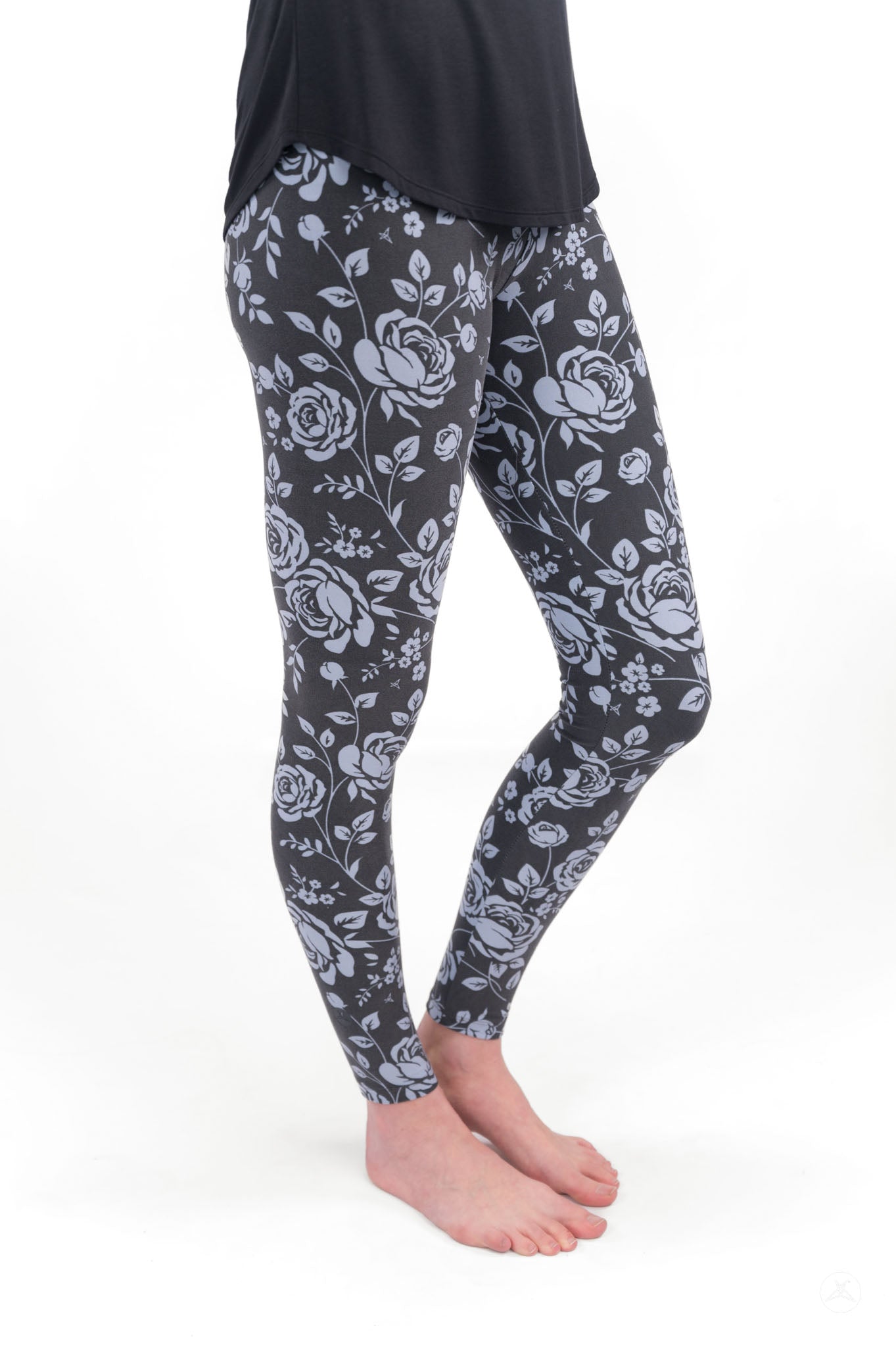 Shadow Garden leggings by SweetLegs featuring soft grey-blue roses on a dark background for subtle elegance.