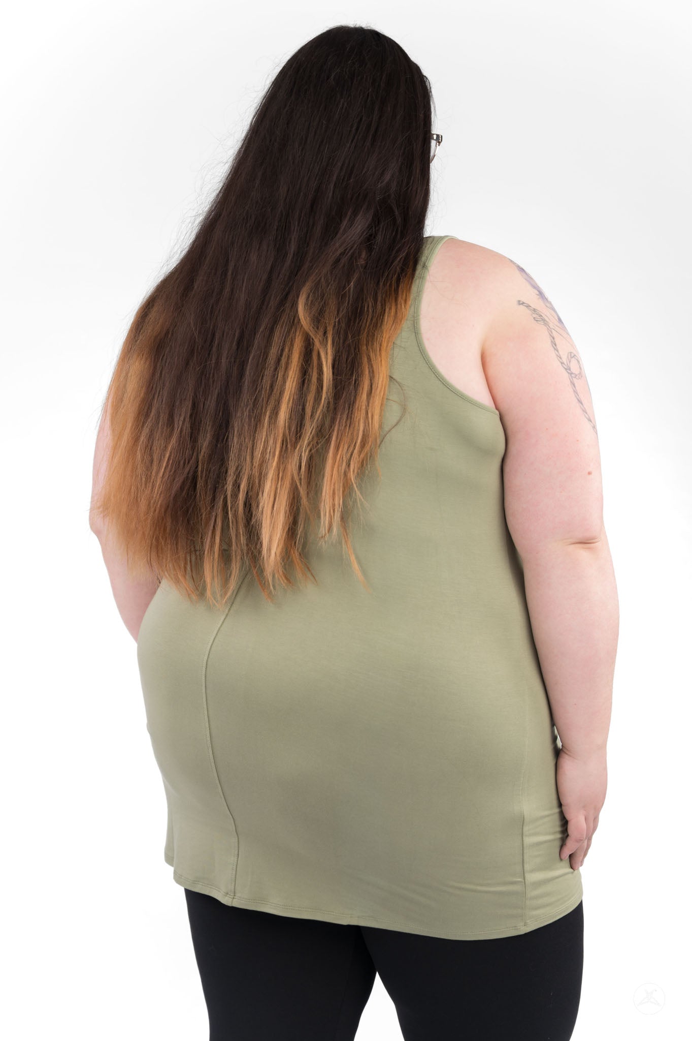Rear view of plus size model wearing olive Classic Layering Tank (Copy) by SweetLegs Canada with long ombre hair and black leggings