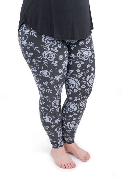 Shadow Garden leggings by SweetLegs featuring soft grey-blue roses on a dark background for subtle elegance