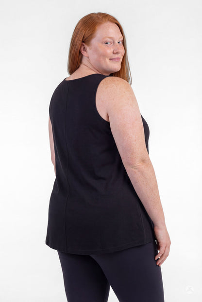 Plus size model wearing sleeveless black High Neck Tank by sweettops shown from back on white background