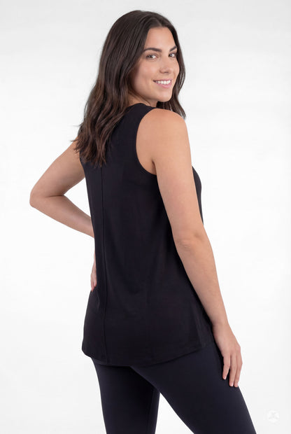Woman smiling wearing black sleeveless High Neck Tank by sweettops with a relaxed fit on white background